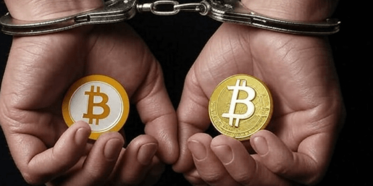 Ilustrasi borgol tangan sambil memegang bitcoin.(grok)